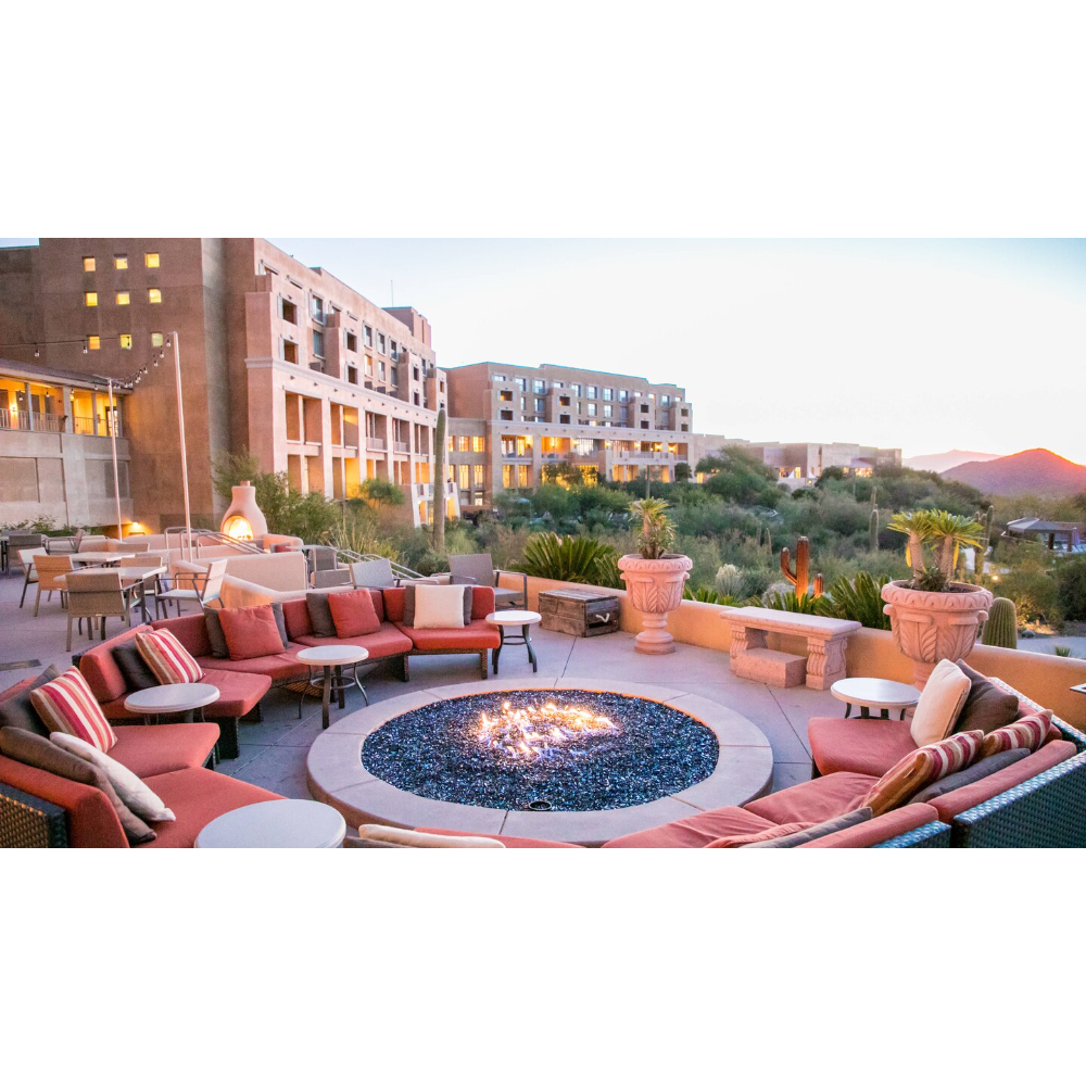 Hotel chairs around an outdoor firepit